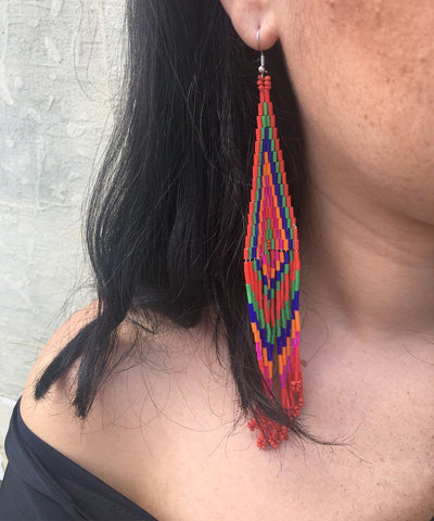 Indian orange earrings worn by Editions LESSisRARE Bijoux