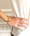 Carole saint germes golden metal ring bracelet worn