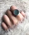 round silver art deco emerald ring worn