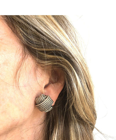 Poggi designer braid clip earrings worn