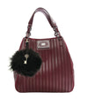 Tassel bag charm in marmot and black leather Editions LESSisRARE worn